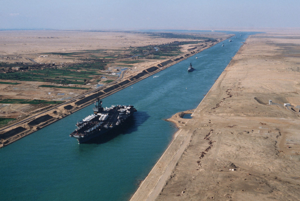An aerial port bow view of the aircraft carrier USS AMERICA (CV 66) during its transit through the canal.